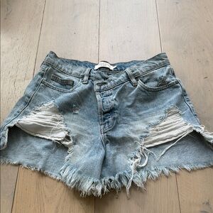 Light Blue Distressed Denim Shorts with Frayed Hem by AODEN